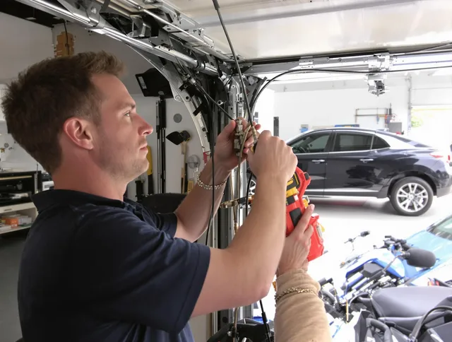 Cheshire Garage Door Repair safety certified technician performing cable replacement in Cheshire