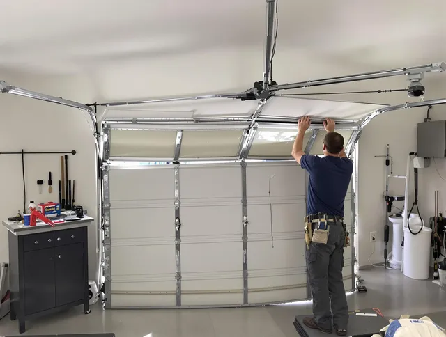 Cheshire Garage Door Repair specialist performing precise section replacement on Cheshire garage door